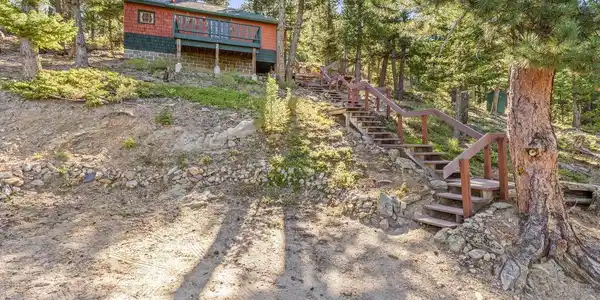 Image 3: Steps up to this treehouse-like cabin Image 3: Steps up to this treehouse-like cabin