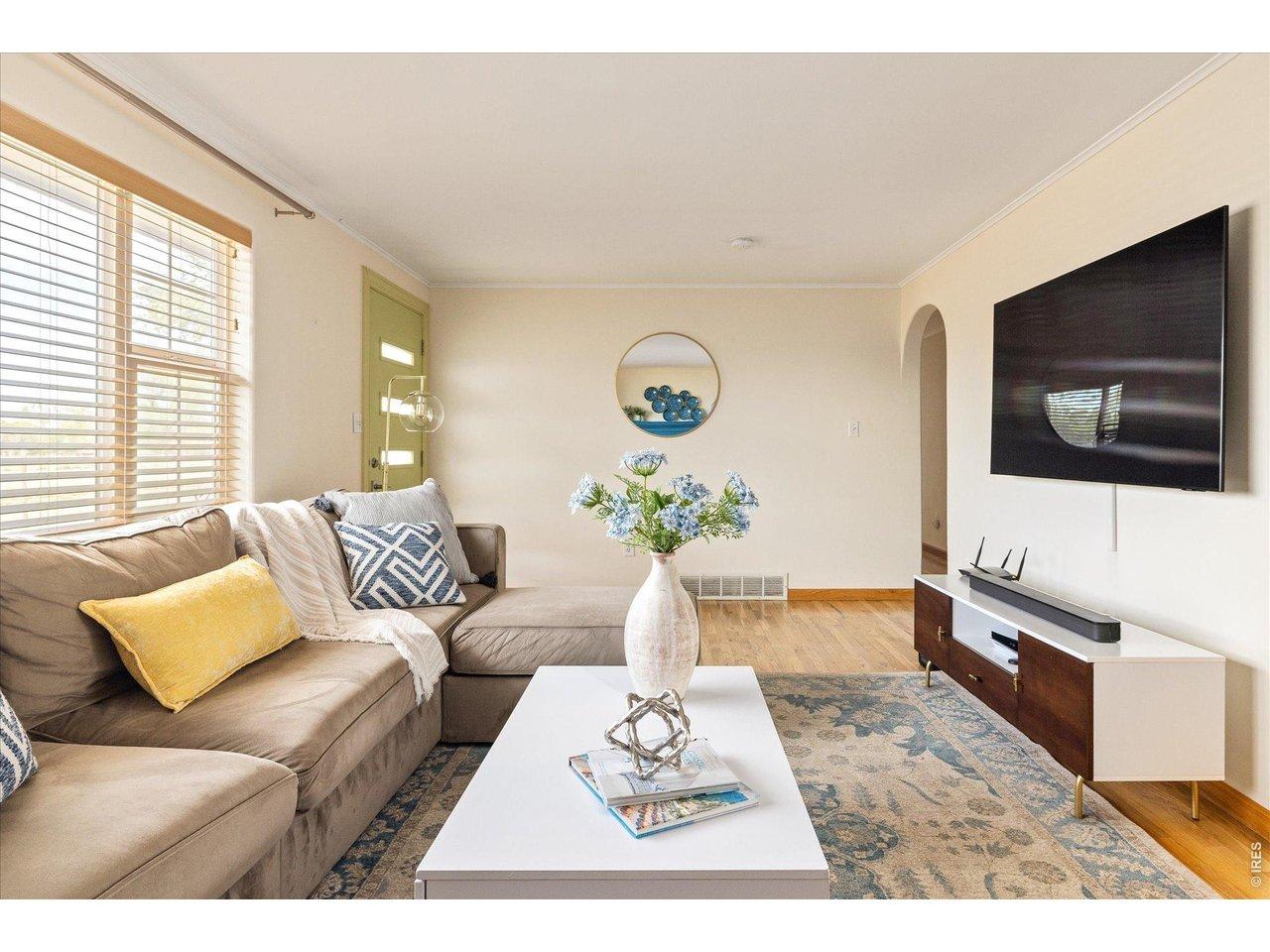 Image 4: bright and welcoming living room with hardwood floors, and an open layout that flows easily to adjacent spaces Image 4: bright and welcoming living room with hardwood floors, and an open layout that flows easily to adjacent spaces