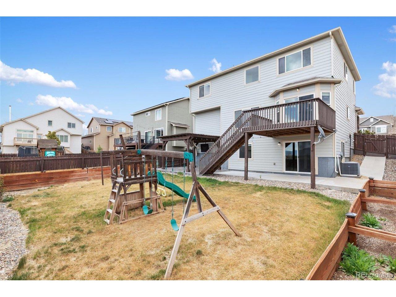 Image 3: Backyard with included playset Image 3: Backyard with included playset
