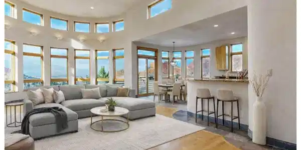 Image 2: Virtually staged great room with a rounded wall full of windows! Image 2: Virtually staged great room with a rounded wall full of windows!