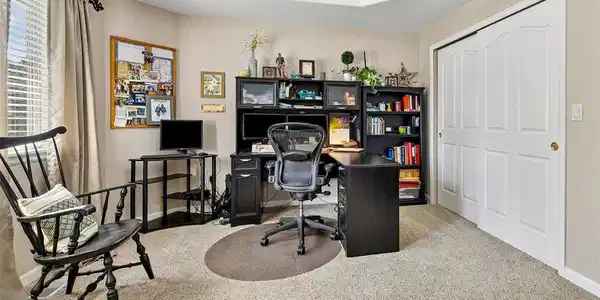 Image 3: Bedroom off entry has been used as a home office Image 3: Bedroom off entry has been used as a home office