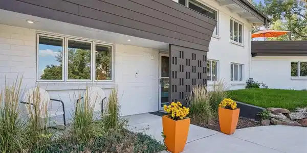 Image 4: Front of Home w/landscaping. Walkout door to lower level. Image 4: Front of Home w/landscaping. Walkout door to lower level.