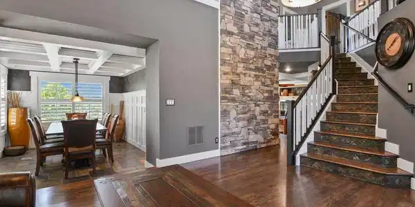 Image 3: Living room, formal dining and beautiful staircase at front door Image 3: Living room, formal dining and beautiful staircase at front door