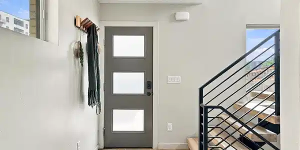Image 4: Step inside to a bright entry and the home's modern open staircase connecting each level. Image 4: Step inside to a bright entry and the home's modern open staircase connecting each level.
