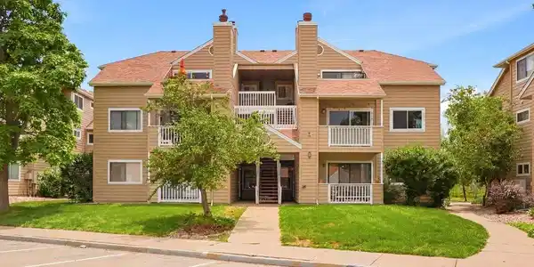 Image 2: Ideally positioned with reserved parking just steps away and surrounded by mature landscaping.