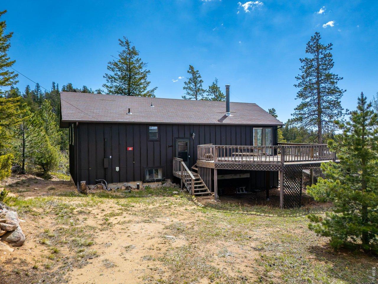 Image 1: Main entrance with expansive deck & views.