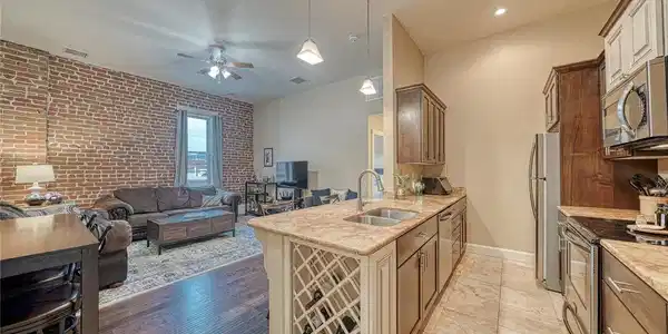 Image 2: Soaring high ceilings and beautiful exposed brick walls create a warm, inviting atmosphere filled with character and charm. Image 2: Soaring high ceilings and beautiful exposed brick walls create a warm, inviting atmosphere filled with character and charm.