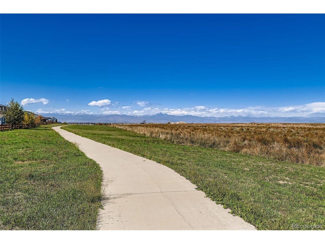Image 3: Walking path on the large greenbelt behind the home. Enjoy the Mountain Views!
