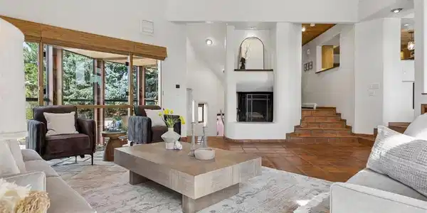 Image 3: Living room with dramatic western views and cozy fireplace Image 3: Living room with dramatic western views and cozy fireplace