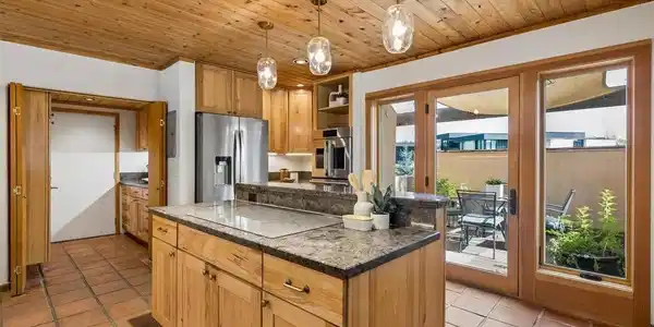 Image 4: Kitchen connects to a shady patio, perfect for morning coffee Image 4: Kitchen connects to a shady patio, perfect for morning coffee