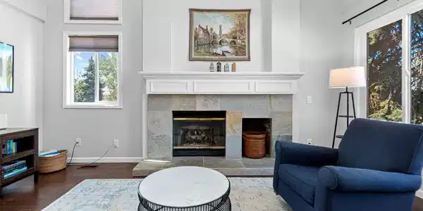 Image 3: A dramatic fireplace anchors the great room, surrounded by soaring ceilings and expansive windows that fill the space with natural light. Image 3: A dramatic fireplace anchors the great room, surrounded by soaring ceilings and expansive windows that fill the space with natural light.