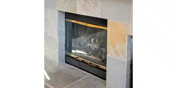 Image 4: The stone surround and classic mantel create a warm focal point. Image 4: The stone surround and classic mantel create a warm focal point.