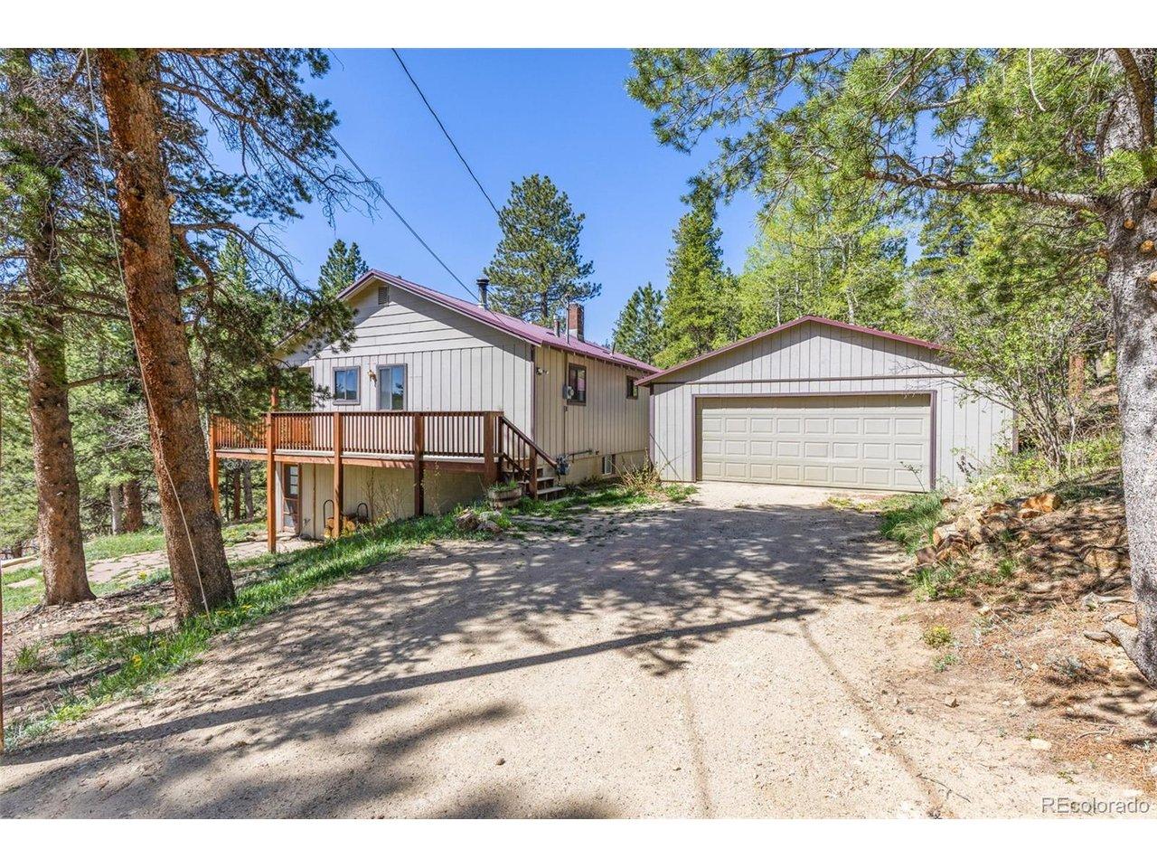 Image 3: Oversized 2 car detached garage and level parking area Image 3: Oversized 2 car detached garage and level parking area
