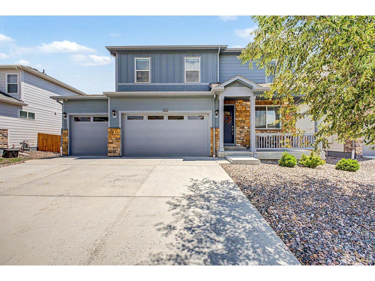 Image 1: Welcome home. Built in 2021, this nearly new Mead home offers timeless curb appeal and all the benefits of modern construction.