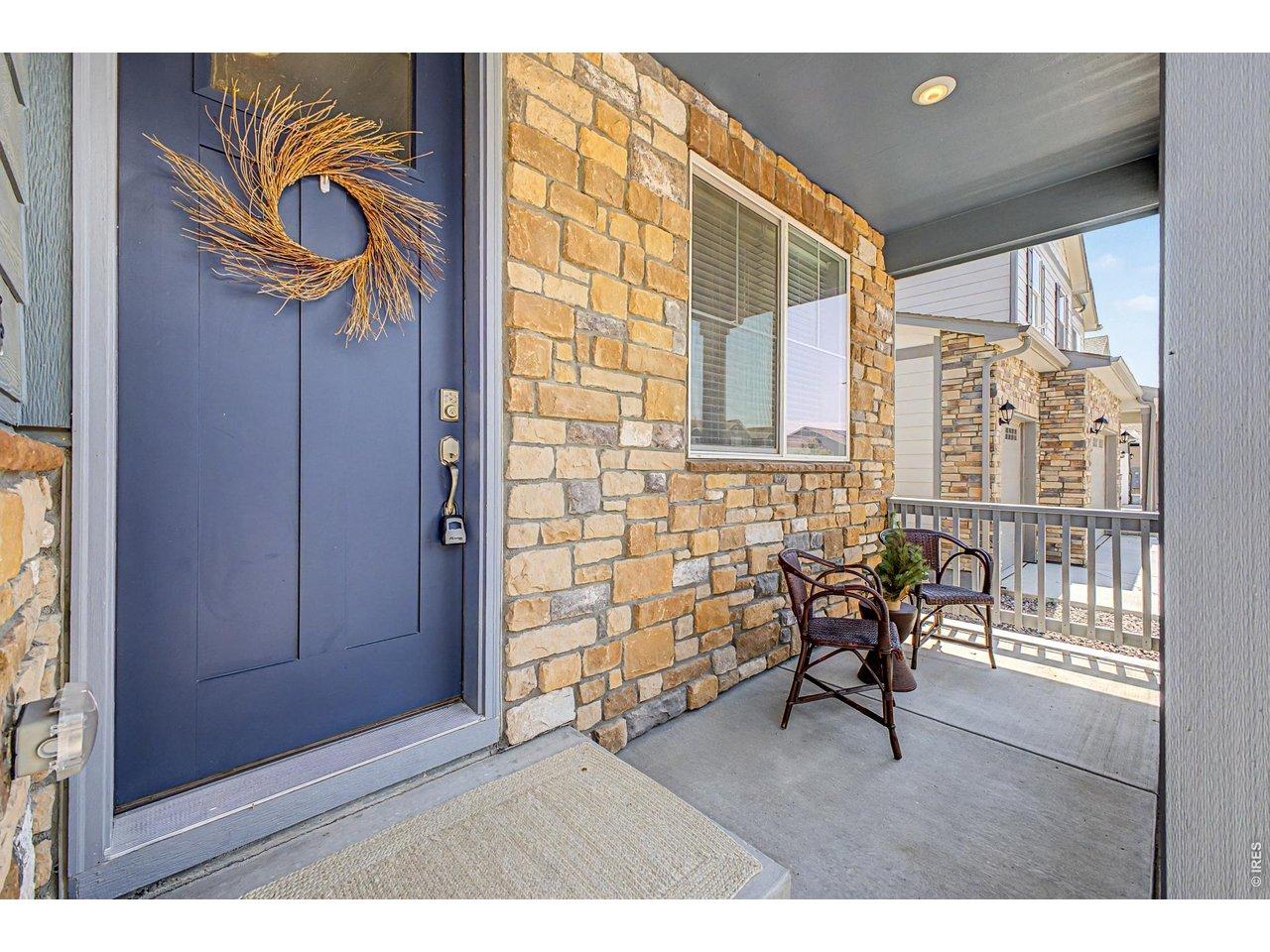 Image 3: Morning coffee starts here. This welcoming front porch is the perfect place to wave to neighbors or unwind after a long day.