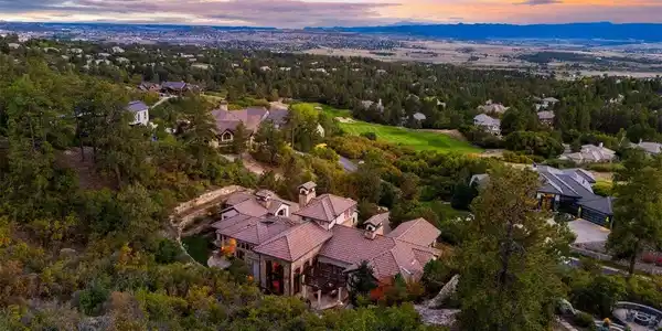 Image 2: Elevated hillside setting with sweeping mountain, valley, and golf course views.