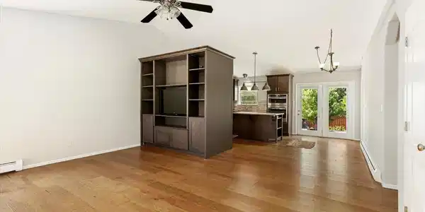 Image 4: Living Room with custom built-in hutch, vaulted ceiling and Hickory engineered hardwood flooring Image 4: Living Room with custom built-in hutch, vaulted ceiling and Hickory engineered hardwood flooring