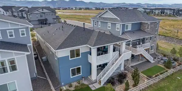 Image 2: breathtaking Colorado skyline and landscaped backyard fully fenced in.
