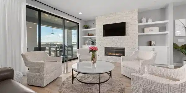 Image 4: open living concept with custom fireplace and opens to your covered deck for entertaining rain or shine