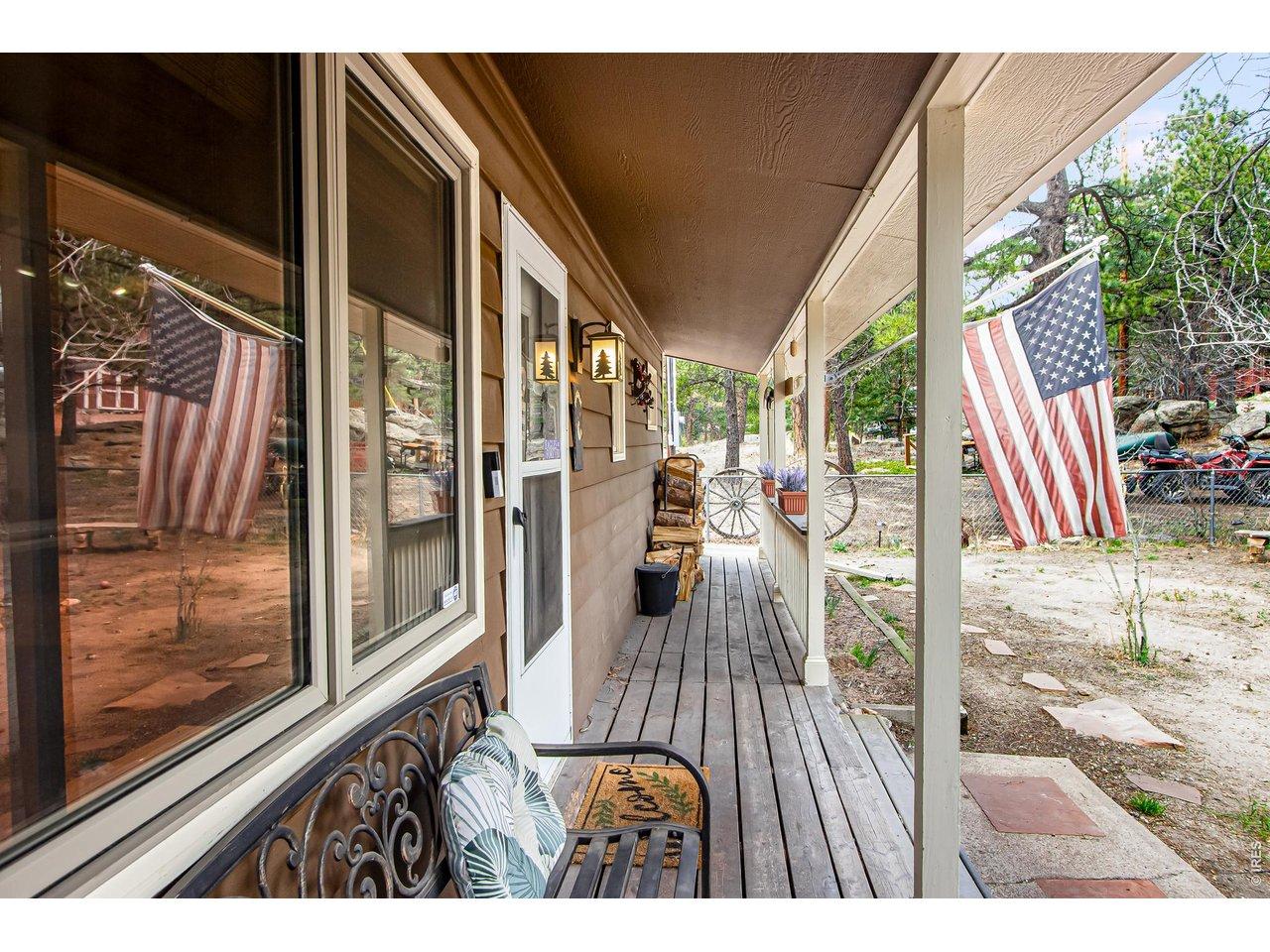 Image 2: Charming and spacious covered front porch, perfect for enjoying the mountain air. Image 2: Charming and spacious covered front porch, perfect for enjoying the mountain air.