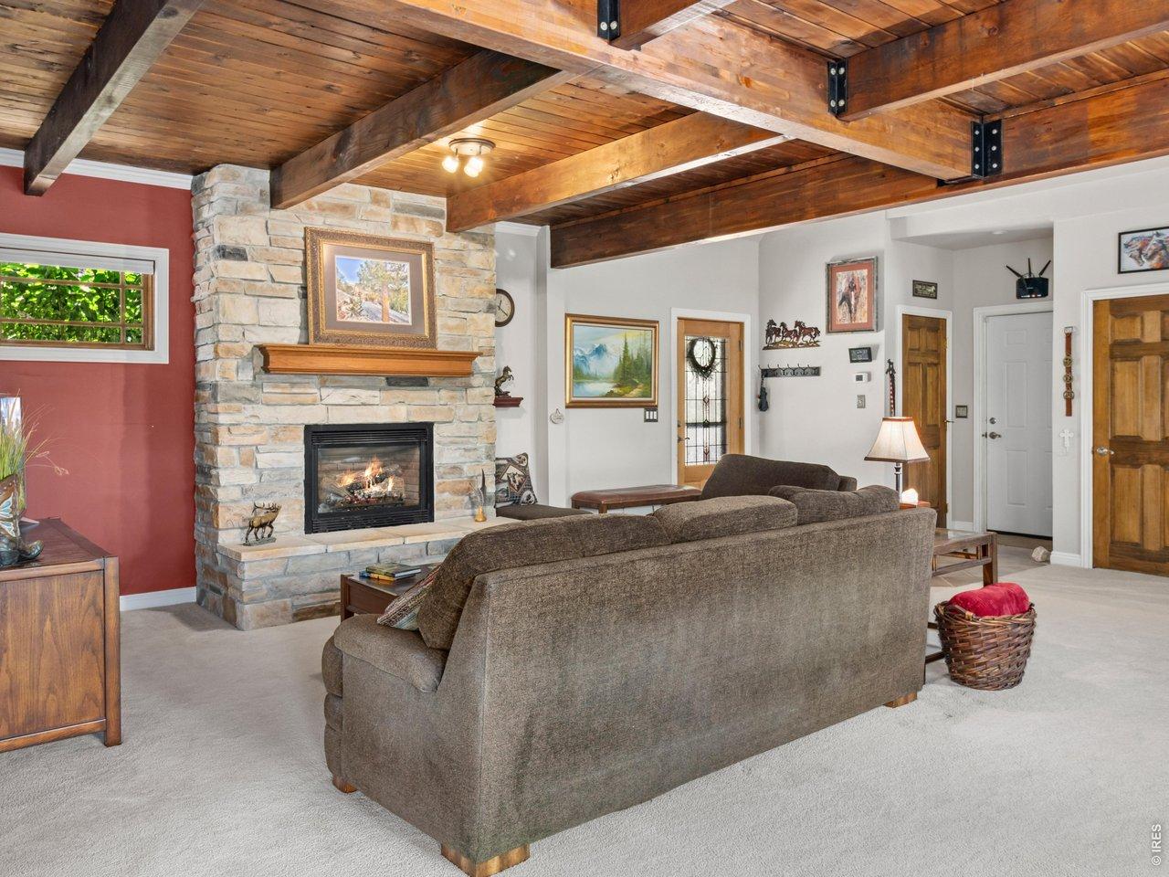 Image 3: Living Room with Gas Fireplace and a Timber Ceiling Image 3: Living Room with Gas Fireplace and a Timber Ceiling