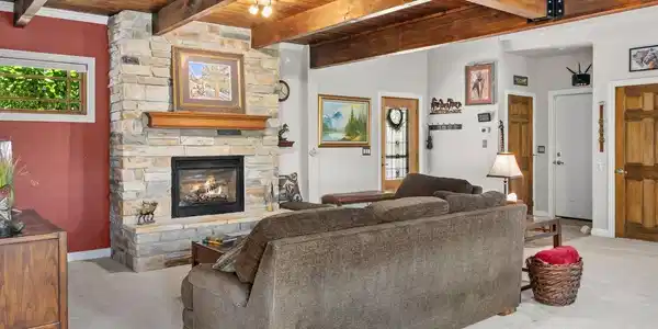 Image 3: Living Room with Gas Fireplace and a Timber Ceiling Image 3: Living Room with Gas Fireplace and a Timber Ceiling