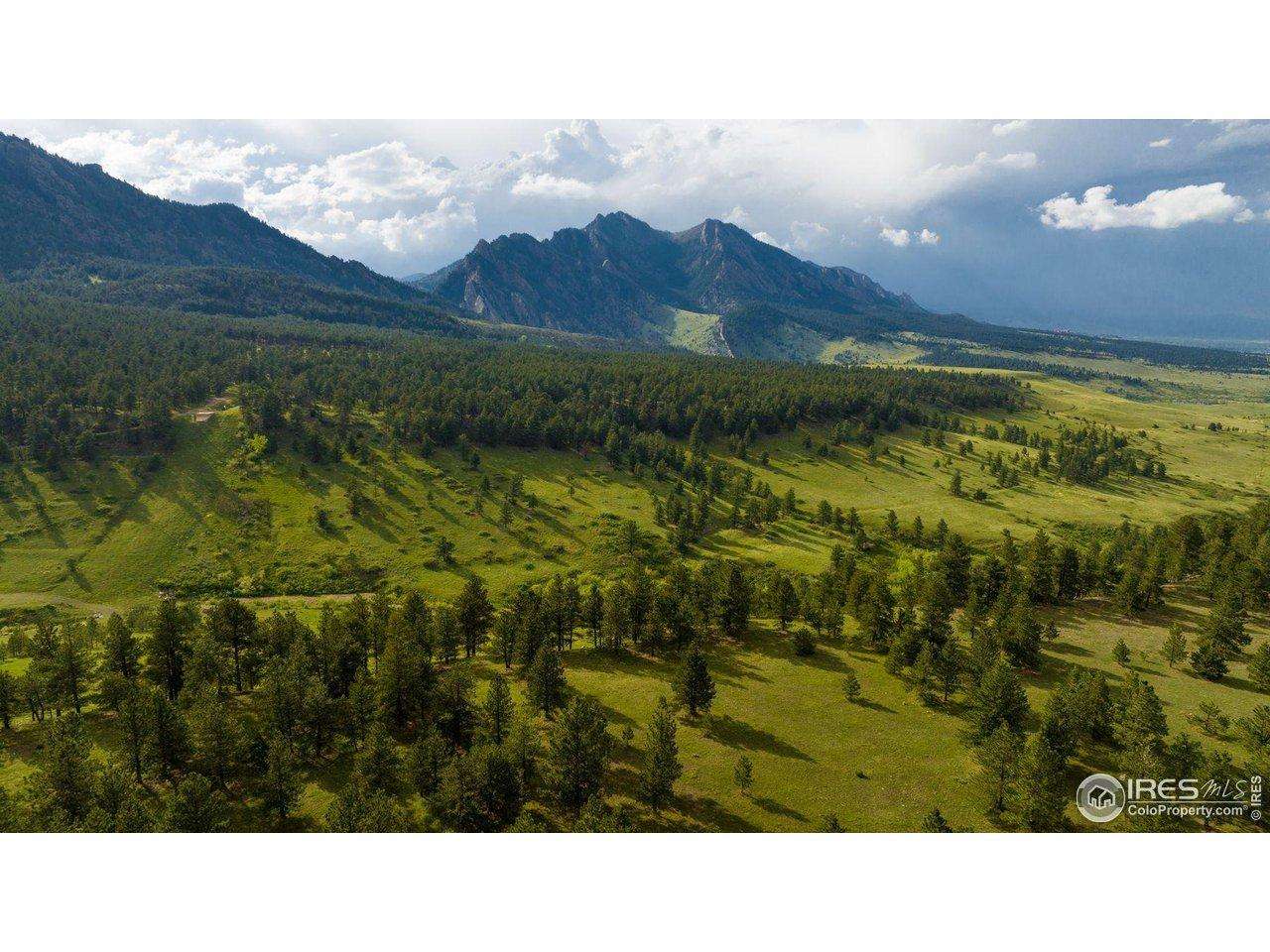 Image 1: Looking northwest from the edge of the lot site, Joann's Reserve, toward the Boulder-Jeffco County line, Doudy Draw, City of Boulder owned Open Space & Mountain Parks and the Flatirons.
