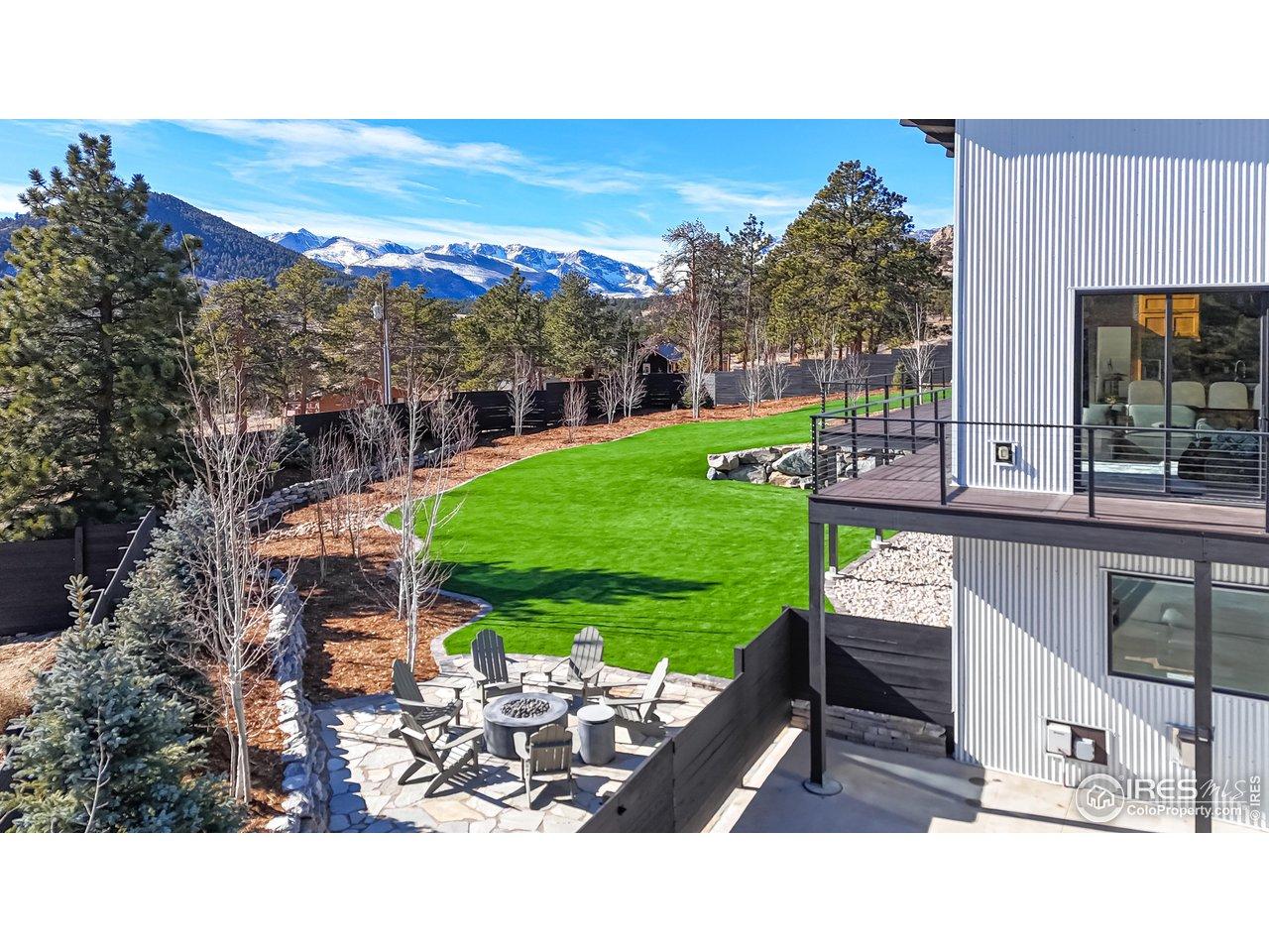 Image 3: Patio and artificial turf for outdoor gathering fun. Aspens provide spring, summer and fall beauty. Image 3: Patio and artificial turf for outdoor gathering fun. Aspens provide spring, summer and fall beauty.