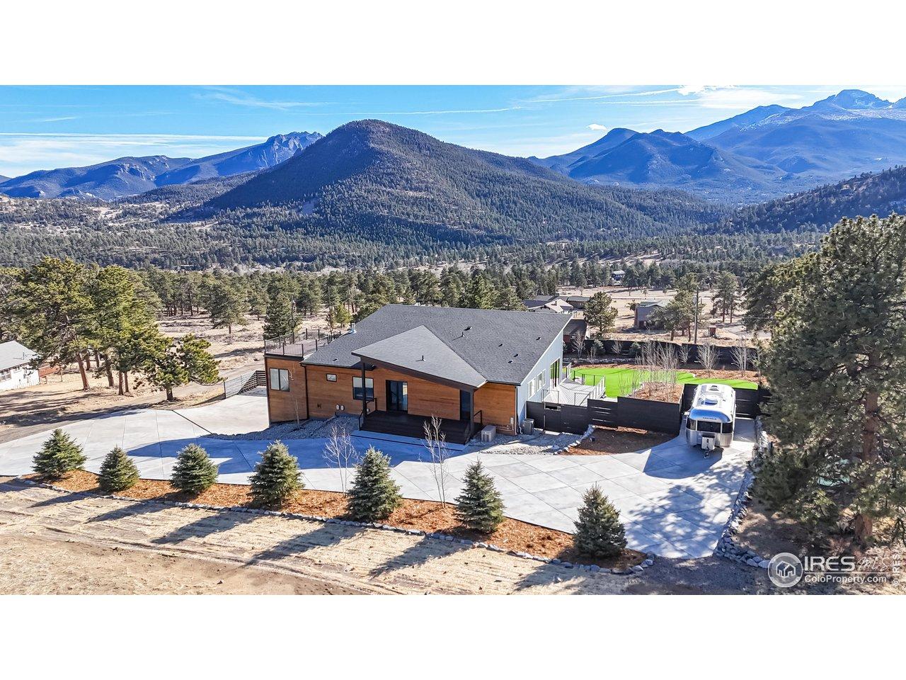 Image 4: Twin Sisters views as well! Dedicated RV parking on a concrete pad with a dedicated 220V hookup. Image 4: Twin Sisters views as well! Dedicated RV parking on a concrete pad with a dedicated 220V hookup.