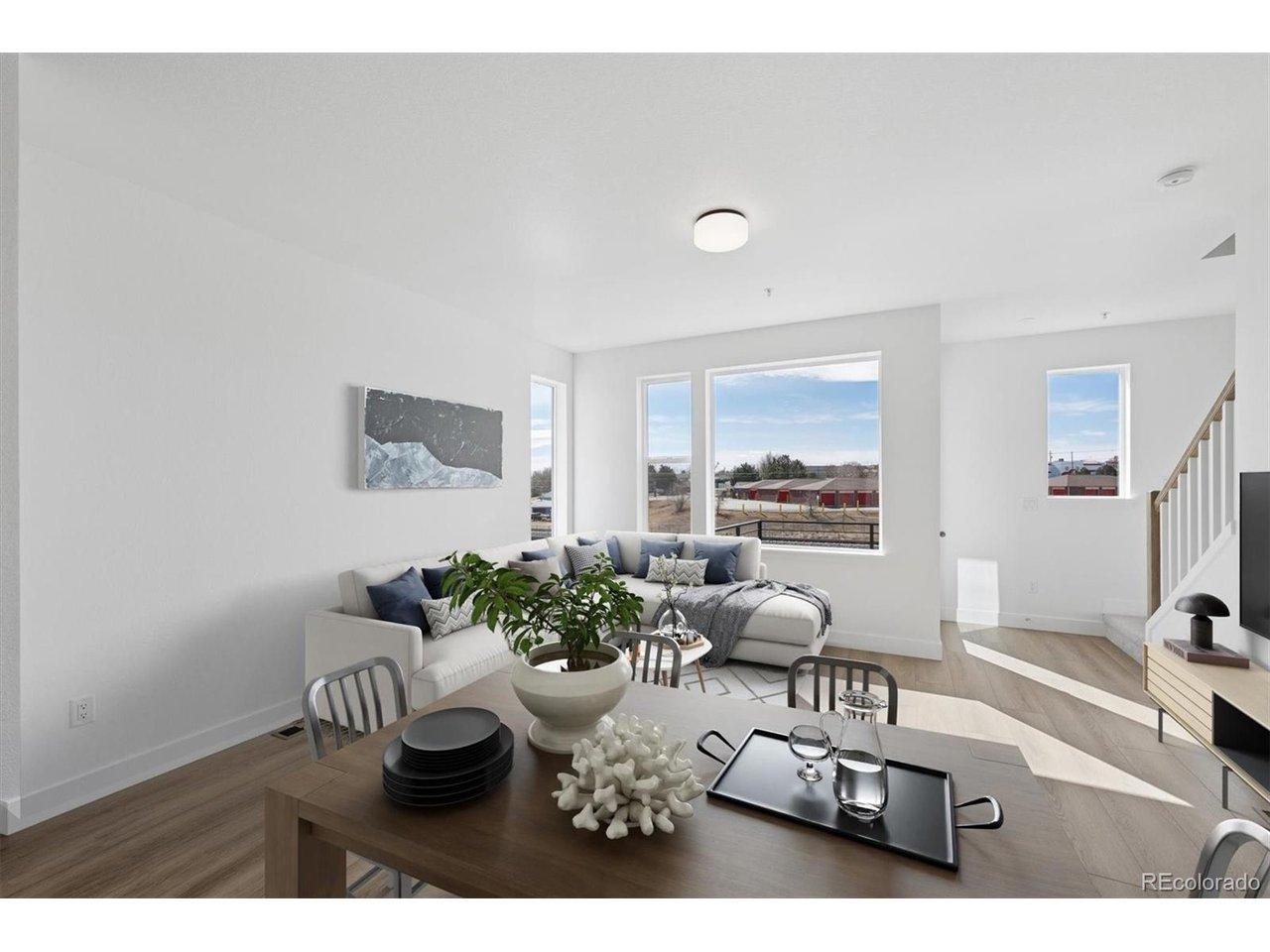 Image 2: Expansive windows create an open, sun-filled atmosphere that complements the home's modern design. Virtually Staged.