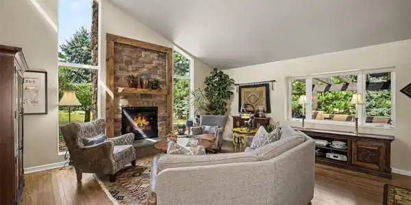 Image 3: Filled with natural light, the vaulted great room is both dramatic and inviting. Image 3: Filled with natural light, the vaulted great room is both dramatic and inviting.