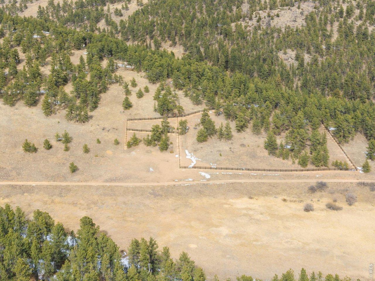 Image 2: Property extends on both sides of the access road, with over 1400 feet of new horse fencing on the northern side. Image 2: Property extends on both sides of the access road, with over 1400 feet of new horse fencing on the northern side.