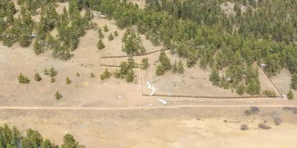 Image 2: Property extends on both sides of the access road, with over 1400 feet of new horse fencing on the northern side. Image 2: Property extends on both sides of the access road, with over 1400 feet of new horse fencing on the northern side.