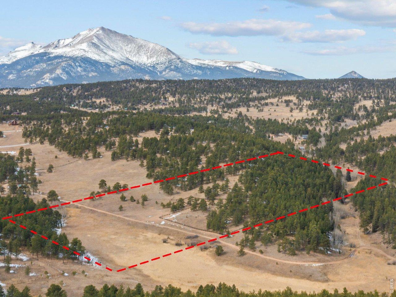 Image 3: Drone view and approximate outline of the 20.29-acre lot. Image 3: Drone view and approximate outline of the 20.29-acre lot.