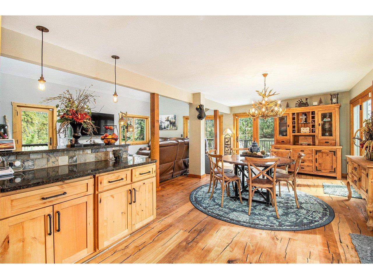 Image 4: Kitchen opens seamlessly to dining and living spaces