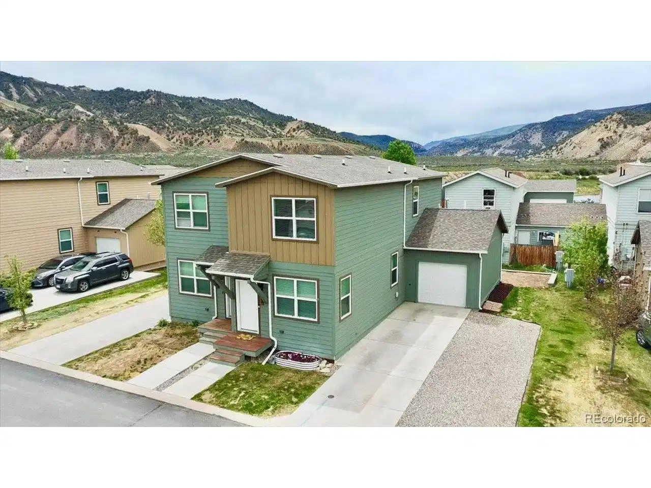 Image 1: Outside View of Home, Garage and Driveways.