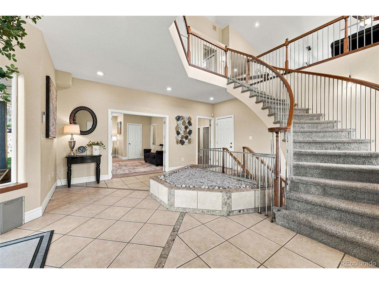 Image 3: Grand Foyer with Spiral Staircase
