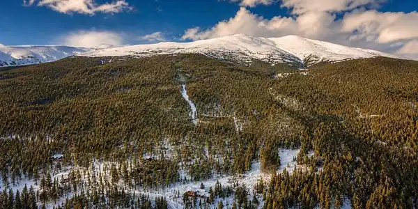 Image 2: Golden hour aerial showing the full ski run, engineered road system, and dramatic mountain sky. The vision is real and it is ready. Image 2: Golden hour aerial showing the full ski run, engineered road system, and dramatic mountain sky. The vision is real and it is ready.