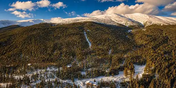 Image 3: Full mountain scale at golden hour. Multiple cleared trail corridors and a snow-capped summit that belongs entirely to you. Image 3: Full mountain scale at golden hour. Multiple cleared trail corridors and a snow-capped summit that belongs entirely to you.