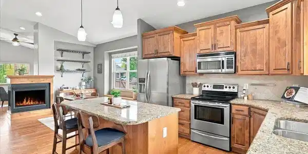 Image 4: Open floor plan joining living, dining, and kitchen. Image 4: Open floor plan joining living, dining, and kitchen.