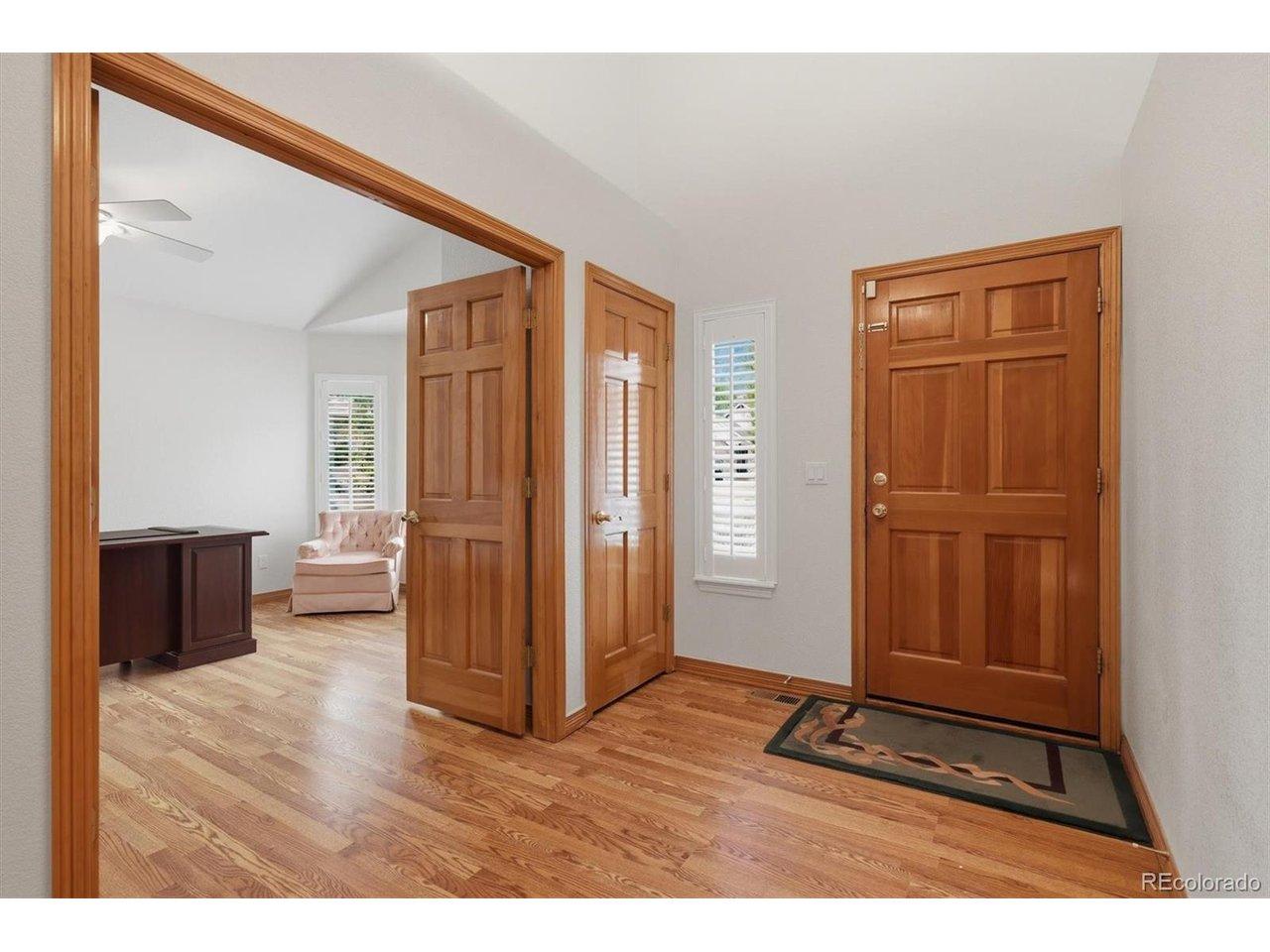 Image 4: Front door foyer with coat closet and office access. Solid wood doors throughout the home and brand new beautiful lvp floors.