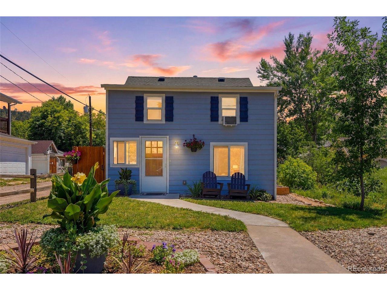 Image 1: Golden hour welcomes you home to 317 3rd Ave - porch lights glowing, Lyons settling in for the evening*vitually enhanced twilight Image 1: Golden hour welcomes you home to 317 3rd Ave - porch lights glowing, Lyons settling in for the evening*vitually enhanced twilight
