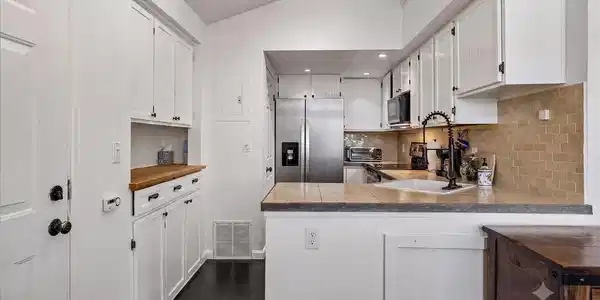 Image 4: Tile backsplash, tile countertops, new appliances Image 4: Tile backsplash, tile countertops, new appliances