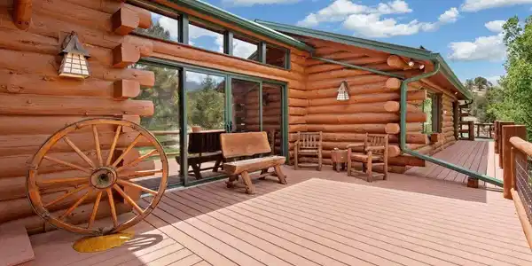 Image 4: Sunroom exterior separating the main living area and a guest/family wing.  Home has split basement design as well.