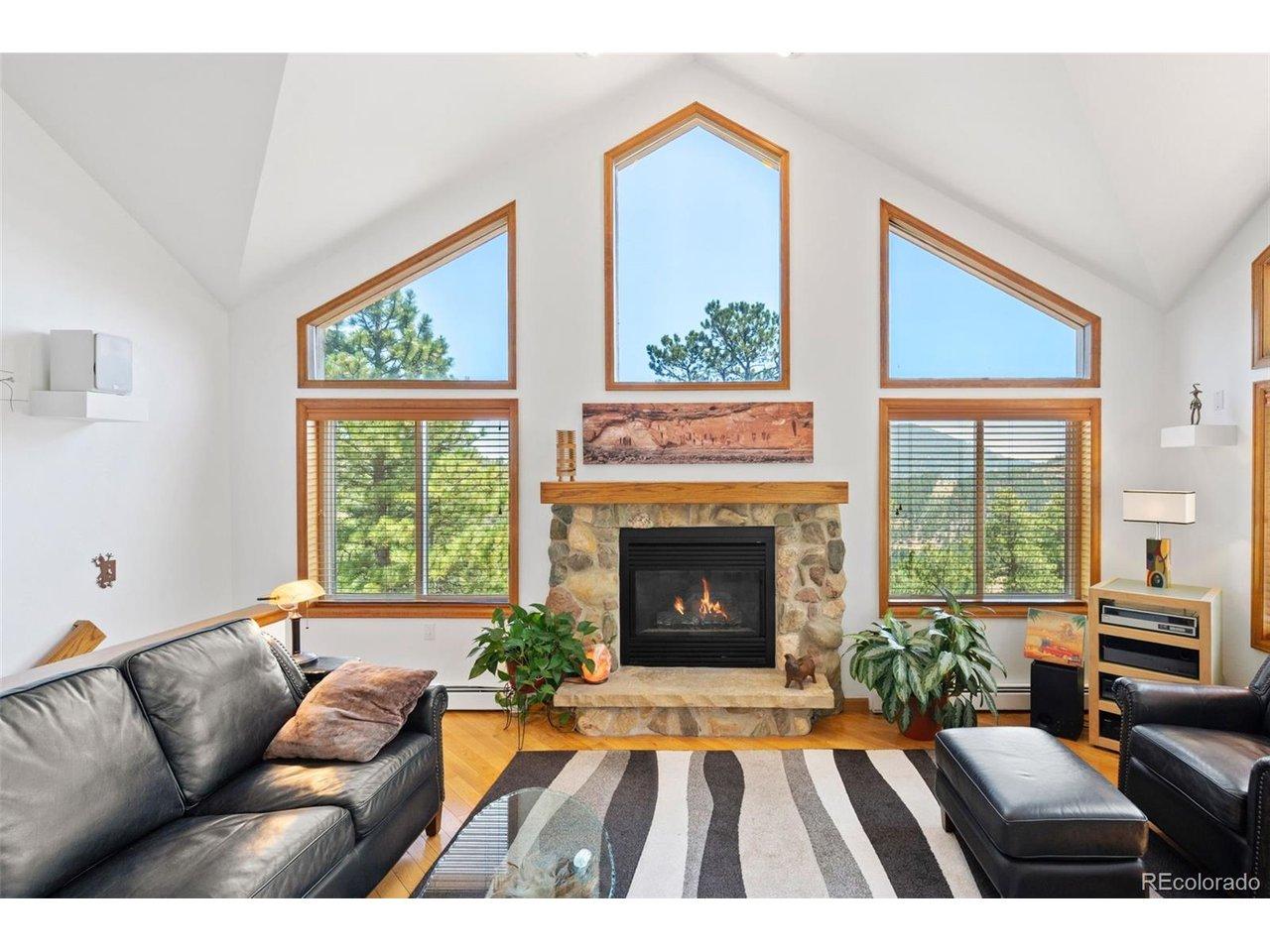 Image 3: Gas Fireplace Wood Floors throughout Main Level (Tile Floor in Kitchen) Image 3: Gas Fireplace Wood Floors throughout Main Level (Tile Floor in Kitchen)