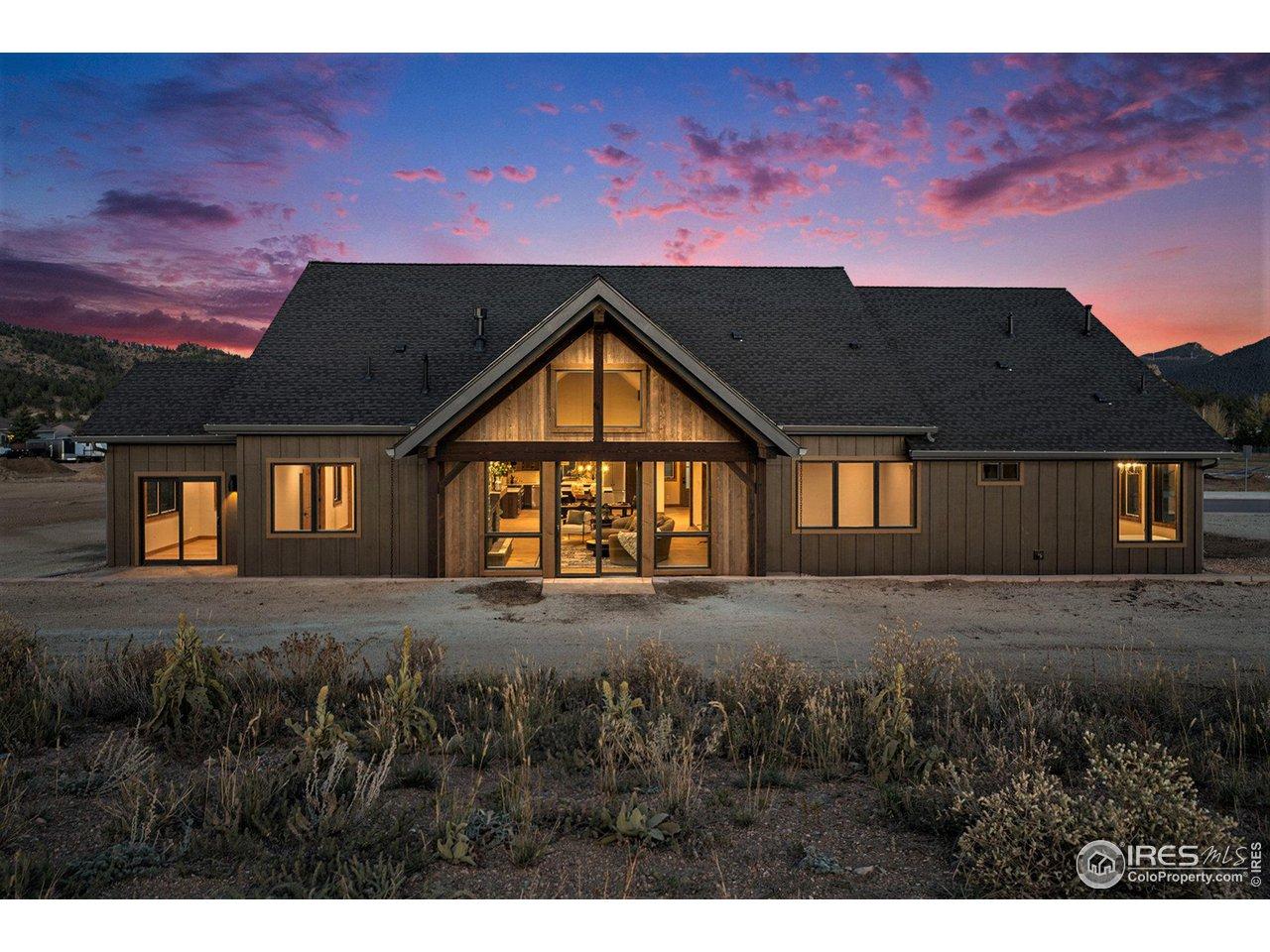 Image 2: Back of home - Ample windows and two sliding glass doors to patio Image 2: Back of home - Ample windows and two sliding glass doors to patio