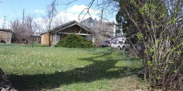 Image 2: Facing the front Southeast corner of the property. House is uninhabitable. Image 2: Facing the front Southeast corner of the property. House is uninhabitable.