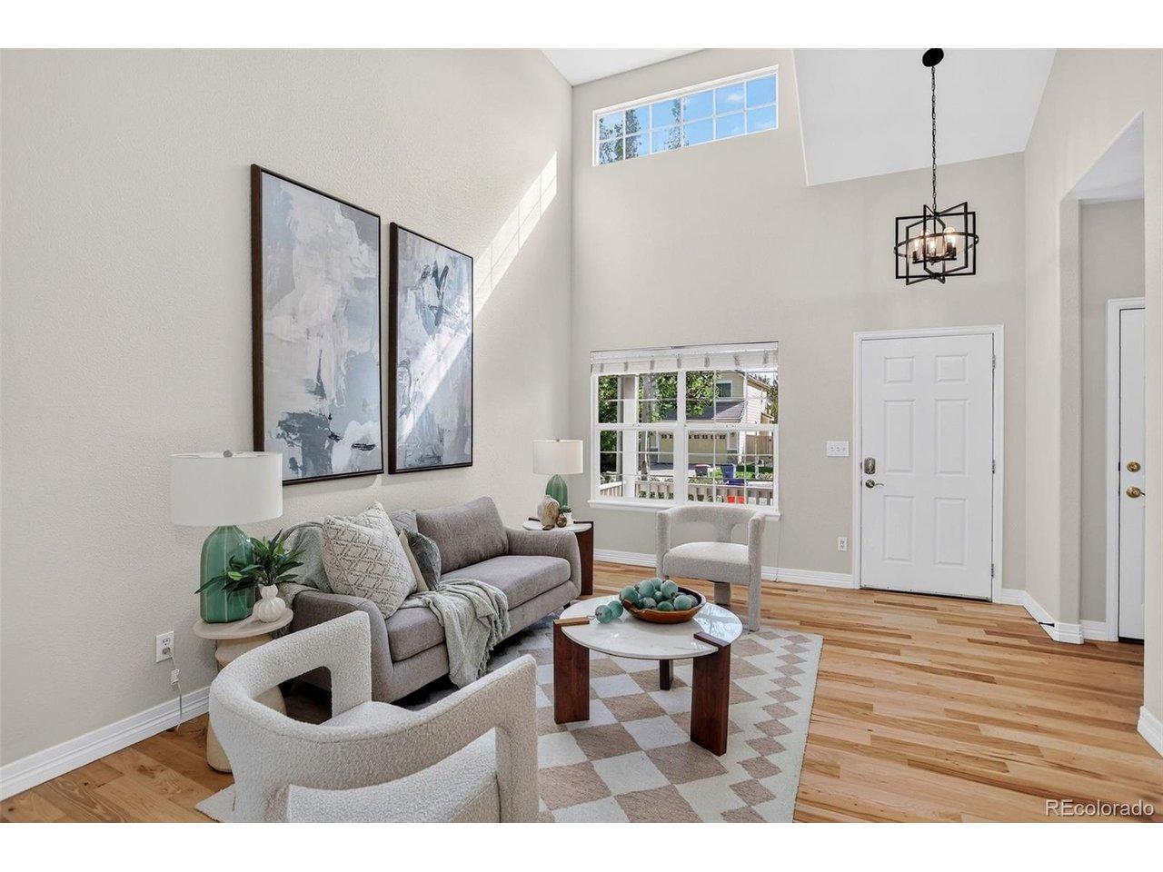 Image 4: Two-story vaulted ceilings greet you in the entryway and front living room