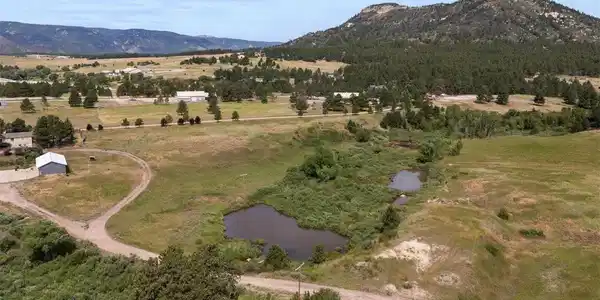 Image 2: Gentle canyons add character to the terrain, and a year-round pond and seasonal stream complete the landscape. Image 2: Gentle canyons add character to the terrain, and a year-round pond and seasonal stream complete the landscape.