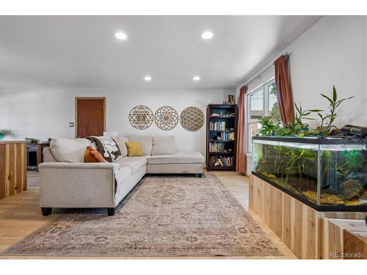 Image 2: Living Room with New Luxury Vinyl Wide-Plank Flooring.